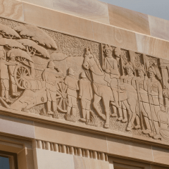 Carvings into the sandstone buildings around the Great Court