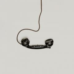 Black, old school, corded telephone receiver