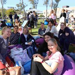 Group of students enjoying some sun and relaxation in the great court