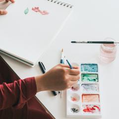 Person holding a paint brush