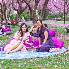 Two students enjoying a picnic at the UQ Lakes