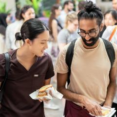 Two students getting sandwiches together