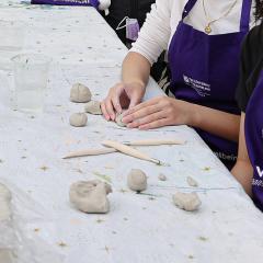 Student moulding clay