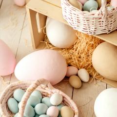 pastel eggs in a wicker basket