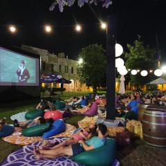 Students watching an outdoor movie in the Great Court