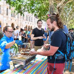 UQ Student receiving food from a food vendor