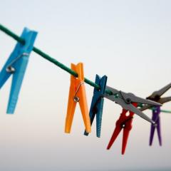 Colourful pegs on a clothing line