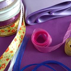 Colourful ribbons on a purple table cloth