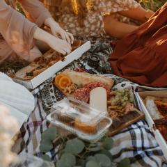 Picnic spread with a sunset in the background